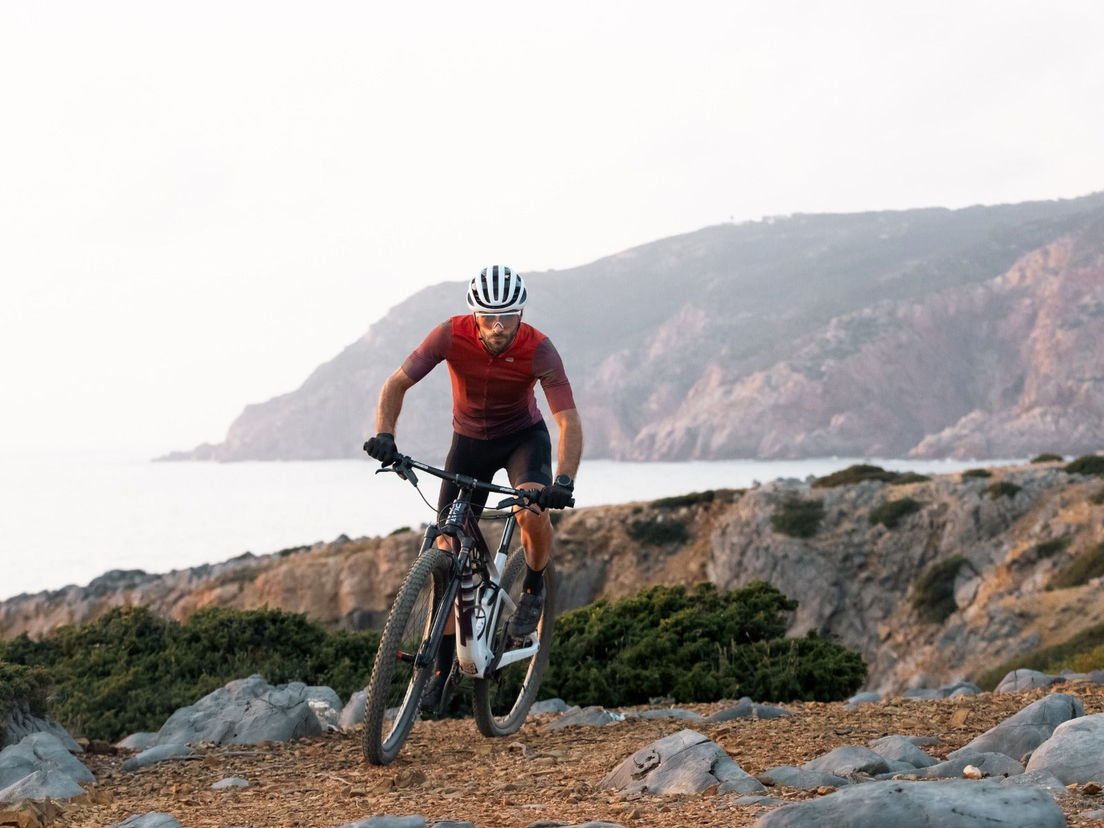 Professional MTB cyclists training near the ocean in Portugal.